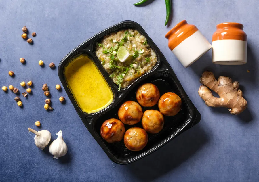 Litti Heist litti chokha meal box with chokha and homemade mustard chutney